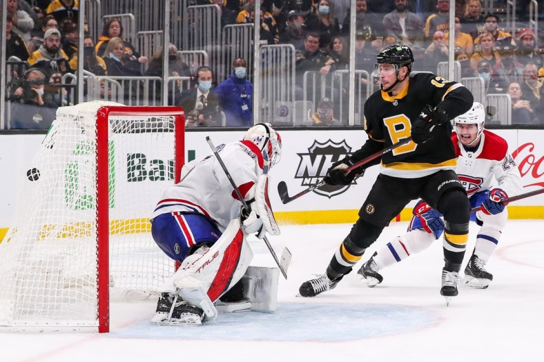 Nov 14, 2021; Boston, Massachusetts, USA; Boston Bruins center Charlie Coyle (13) scores a goal during the third period against the Montreal Canadiens at TD Garden. Mandatory Credit: Paul Rutherford-USA TODAY Sports