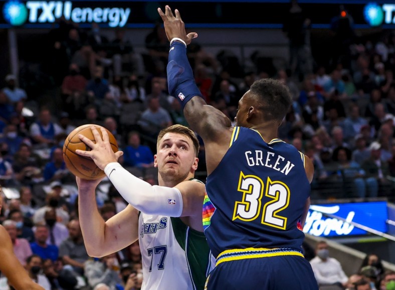 Nov 15, 2021; Dallas, Texas, USA;  Dallas Mavericks guard Luka Doncic (77) looks to shoot as Denver Nuggets forward Jeff Green (32) defends during the first quarter at American Airlines Center. Mandatory Credit: Kevin Jairaj-USA TODAY Sports