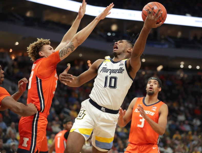 Marquette Golden Eagles forward Justin Lewis (10) looks to shoot while being guarded by Illinois Fighting Illini forward Coleman Hawkins (33) during the first half of their game at Fiserv Forum in Milwaukee on Monday, Nov. 15, 2021.  -  Photo by Mike De Sisti / Milwaukee Journal Sentinel ORG XMIT: DBY1

Mjs Mumen 03041