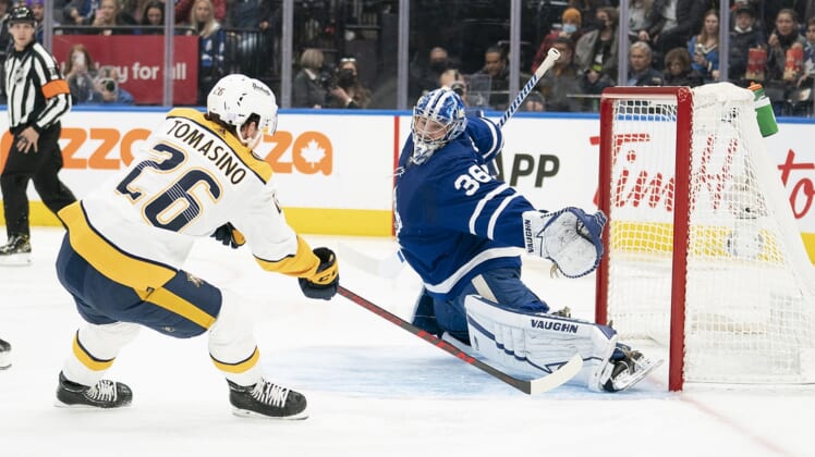 Nov 16, 2021; Toronto, Ontario, CAN;  Nashville Predators center Philip Tomasino (26) charges the net on Toronto Maple Leafs goaltender Jack Campbell (36) during the first period  at Scotiabank Arena. Mandatory Credit: Nick Turchiaro-USA TODAY Sports