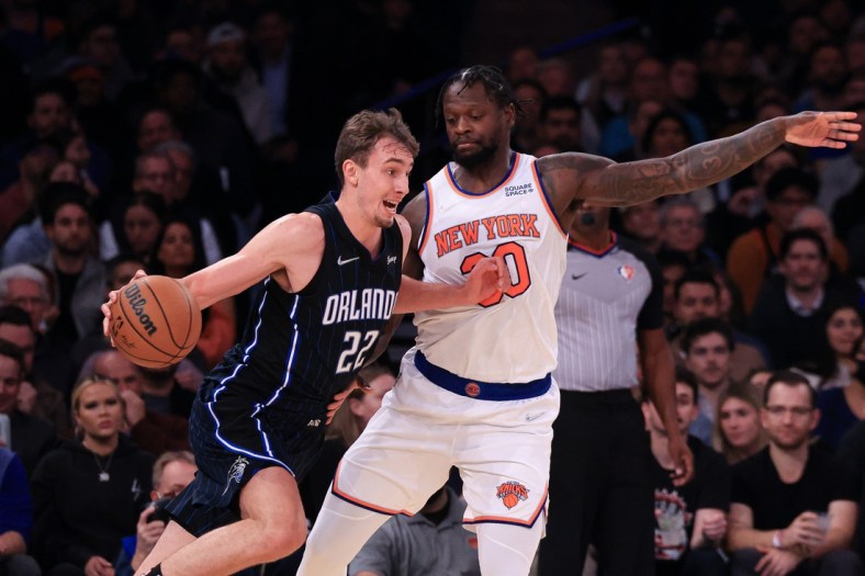 Nov 17, 2021; New York, New York, USA; Orlando Magic forward Franz Wagner (22) drives to the basket against New York Knicks forward Julius Randle (30) during the first half at Madison Square Garden. Mandatory Credit: Vincent Carchietta-USA TODAY Sports