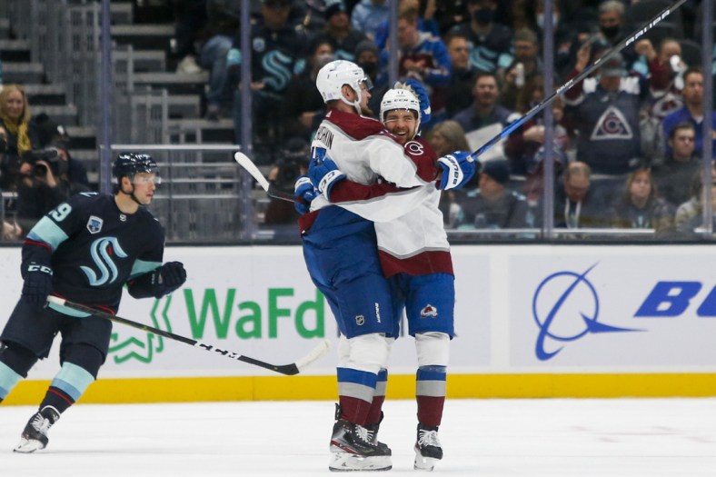 Nov 19, 2021; Seattle, Washington, USA; Colorado Avalanche right wing Valeri Nichushkin (13) celebrates with left wing Tyson Jost (17) after scoring a goal against the Seattle Kraken during the first period at Climate Pledge Arena. Mandatory Credit: Joe Nicholson-USA TODAY Sports