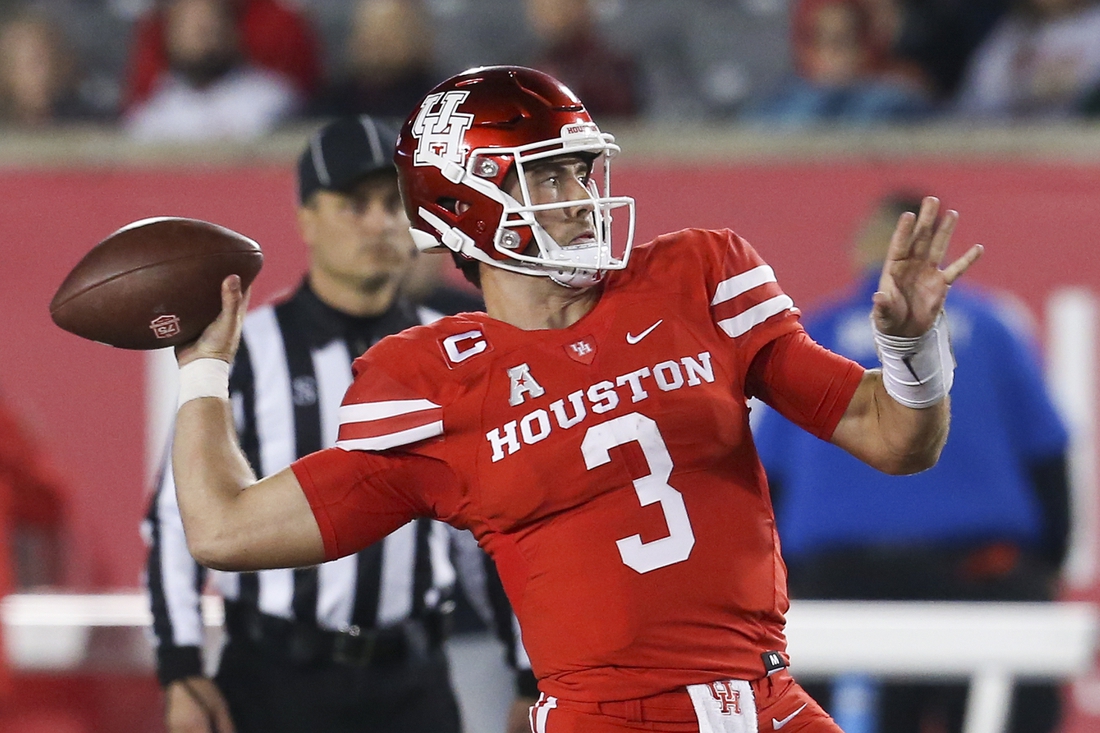 Nov 19, 2021; Houston, Texas, USA; Houston Cougars quarterback Clayton Tune (3) drops back to pass against the Memphis Tigers  in the fourth quarter at TDECU Stadium. Houston Cougars won 31 to 13. Mandatory Credit: Thomas Shea-USA TODAY Sports