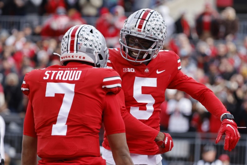 Nov 20, 2021; Columbus, Ohio, USA;  Ohio State Buckeyes wide receiver Garrett Wilson (5) celebrates his touch down with quarterback C.J. Stroud (7) in the first half against the Michigan State Spartans at Ohio Stadium. Mandatory Credit: Rick Osentoski-USA TODAY Sports