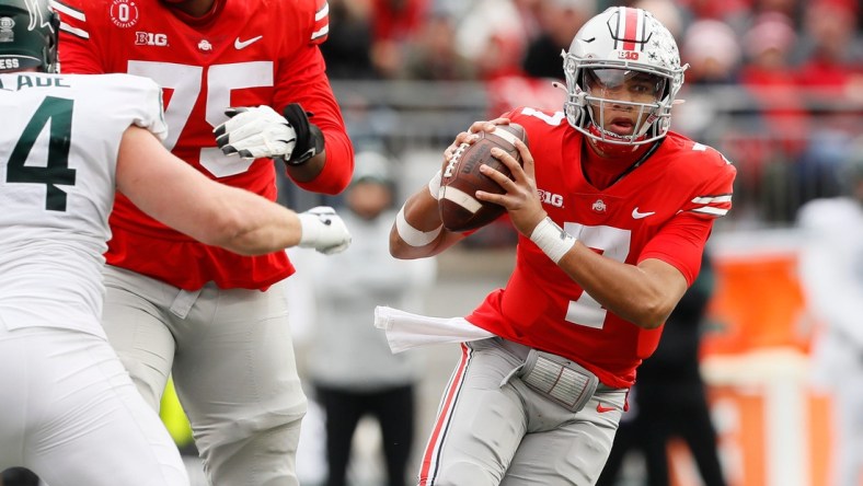 Ohio State Buckeyes quarterback C.J. Stroud (7) scrambles out of the pocket during the third quarter of the NCAA football game against the Michigan State Spartans at Ohio Stadium in Columbus on Saturday, Nov. 20, 2021.

Michigan State Spartans At Ohio State Buckeyes Football