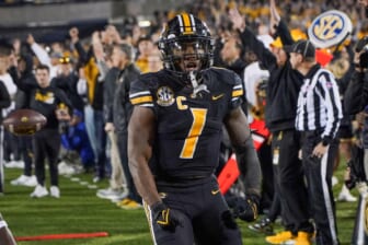 Nov 20, 2021; Columbia, Missouri, USA; Missouri Tigers running back Tyler Badie (1) celebrates after a play against the Florida Gators in overtime at Faurot Field at Memorial Stadium. Mandatory Credit: Denny Medley-USA TODAY Sports