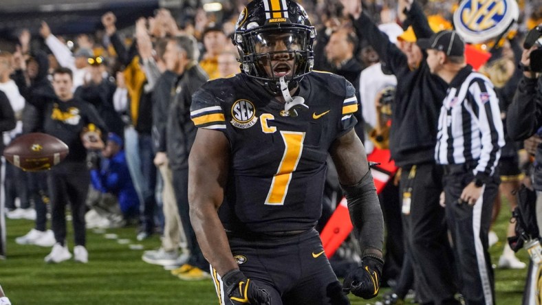 Nov 20, 2021; Columbia, Missouri, USA; Missouri Tigers running back Tyler Badie (1) celebrates after a play against the Florida Gators in overtime at Faurot Field at Memorial Stadium. Mandatory Credit: Denny Medley-USA TODAY Sports