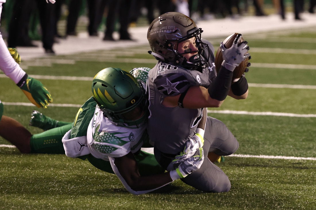 Nov 20, 2021; Salt Lake City, Utah, USA; Utah Utes wide receiver Britain Covey (18) is taken down at the one-yard line in the second quarter against the Oregon Ducks at Rice-Eccles Stadium. Mandatory Credit: Jeffrey Swinger-USA TODAY Sports