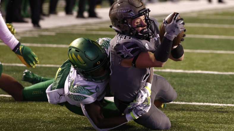 Nov 20, 2021; Salt Lake City, Utah, USA; Utah Utes wide receiver Britain Covey (18) is taken down at the one-yard line in the second quarter against the Oregon Ducks at Rice-Eccles Stadium. Mandatory Credit: Jeffrey Swinger-USA TODAY Sports