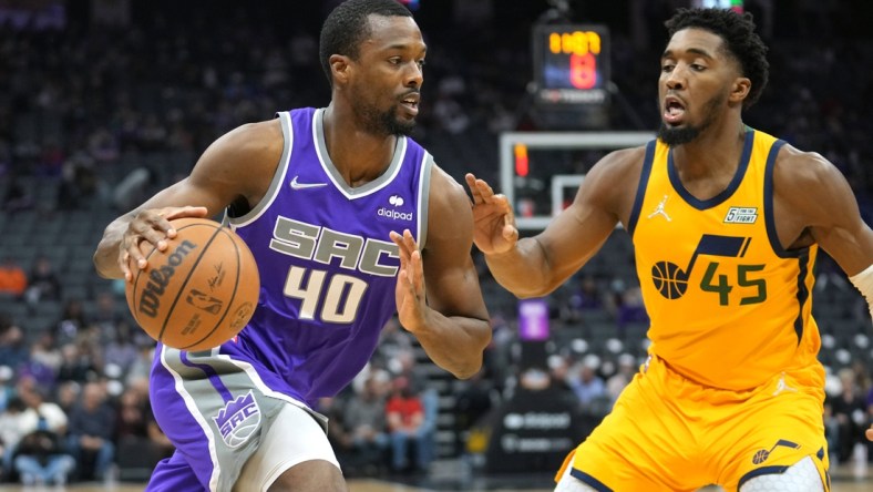 Nov 20, 2021; Sacramento, California, USA; Sacramento Kings forward Harrison Barnes (40) drives while being defended by Utah Jazz guard Donovan Mitchell (45) during the first quarter at Golden 1 Center. Mandatory Credit: Darren Yamashita-USA TODAY Sports