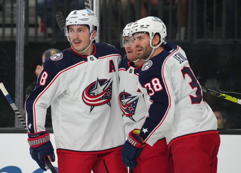 Nov 20, 2021; Las Vegas, Nevada, USA;  Columbus Blue Jackets center Gustav Nyquist (14) celebrates with Columbus Blue Jackets defenseman Zach Werenski (8) and Columbus Blue Jackets center Boone Jenner (38) after scoring a first period goal against the Vegas Golden Knights at T-Mobile Arena. Mandatory Credit: Stephen R. Sylvanie-USA TODAY Sports