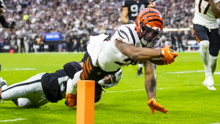 Nov 21, 2021; Paradise, Nevada, USA; Cincinnati Bengals running back Joe Mixon (28) dives into the end zone to score a touchdown against the Las Vegas Raiders in the first half at Allegiant Stadium. Mandatory Credit: Mark J. Rebilas-USA TODAY Sports
