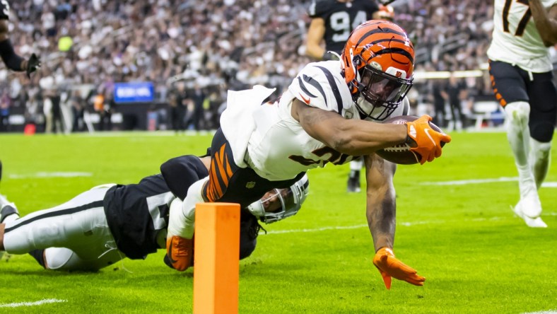 Nov 21, 2021; Paradise, Nevada, USA; Cincinnati Bengals running back Joe Mixon (28) dives into the end zone to score a touchdown against the Las Vegas Raiders in the first half at Allegiant Stadium. Mandatory Credit: Mark J. Rebilas-USA TODAY Sports