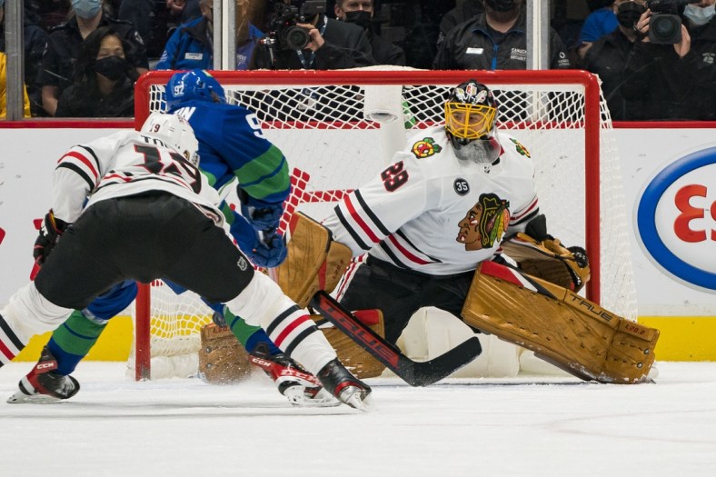 Nov 21, 2021; Vancouver, British Columbia, CAN; Chicago Blackhawks goalie Marc-Andre Fleury (29) makes a save on Vancouver Canucks forward Vasily Podkolzin (92) in the second period at Rogers Arena. Mandatory Credit: Bob Frid-USA TODAY Sports