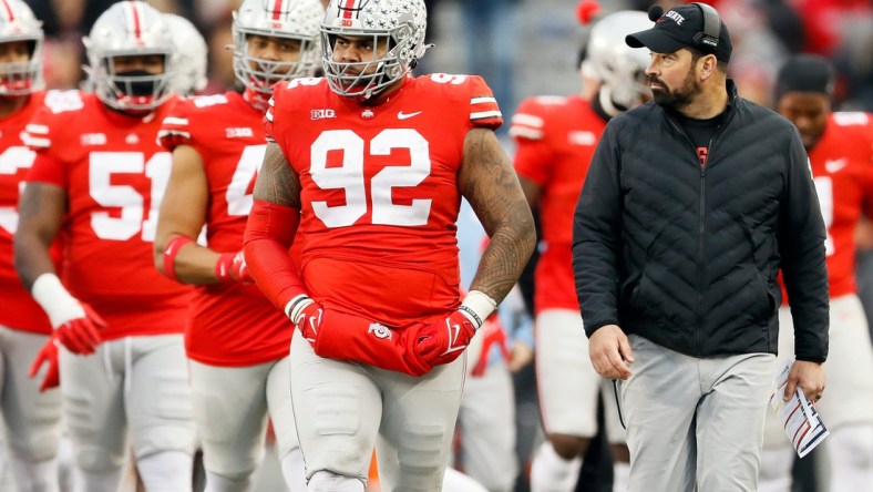 Ohio State Buckeyes defensive tackle Haskell Garrett (92) walks beside head coach Ryan Day during the third quarter of the NCAA football game at Ohio Stadium in Columbus on Saturday, Nov. 20, 2021.

Michigan State Spartans At Ohio State Buckeyes Football