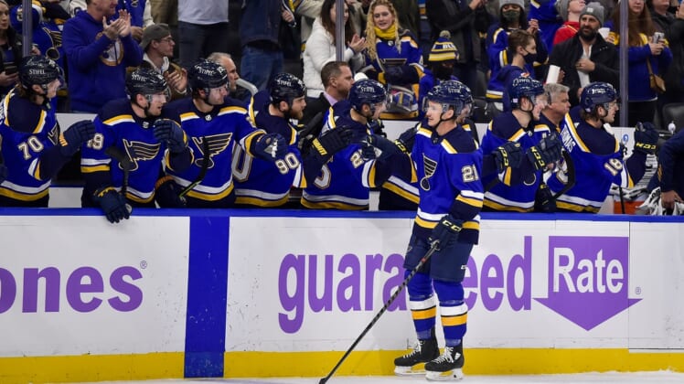 Nov 22, 2021; St. Louis, Missouri, USA;  St. Louis Blues center Tyler Bozak (21) is congratulated by teammates after scoring against the Vegas Golden Knights during the first period at Enterprise Center. Mandatory Credit: Jeff Curry-USA TODAY Sports