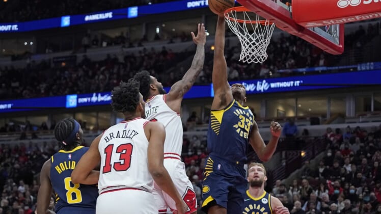 Nov 22, 2021; Chicago, Illinois, USA; Indiana Pacers center Myles Turner (33) blocks Chicago Bulls guard Coby White (0) shot during the first half at United Center. Mandatory Credit: David Banks-USA TODAY Sports