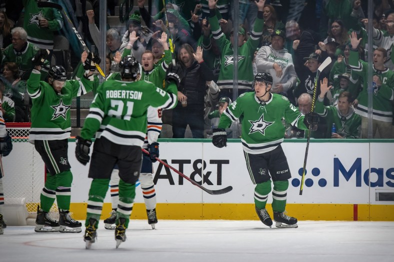 Nov 23, 2021; Dallas, Texas, USA; Dallas Stars right wing Alexander Radulov (47) and left wing Jason Robertson (21) and left wing Roope Hintz (24) celebrate a power play goal by Roope Hintz during the first period against the Edmonton Oilers at the American Airlines Center. Mandatory Credit: Jerome Miron-USA TODAY Sports