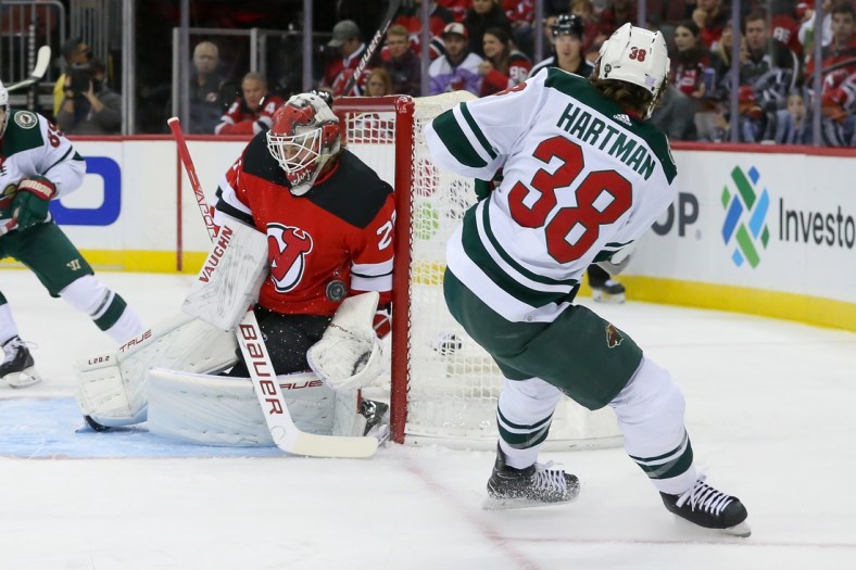 Nov 24, 2021; Newark, New Jersey, USA; New Jersey Devils goaltender Mackenzie Blackwood (29) makes a save against Minnesota Wild right wing Ryan Hartman (38) during the first period at Prudential Center. Mandatory Credit: Tom Horak-USA TODAY Sports
