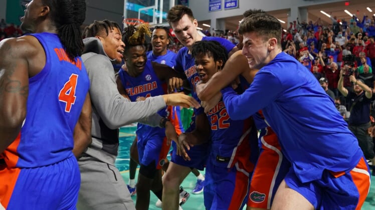 Nov 24, 2021; Fort Myers, Florida, USA; Florida Gators guard Tyree Appleby (22) celebrates with teammates after making the game winning three point shot to defeat the Ohio State Buckeyes at Suncoast Credit Union Arena. Mandatory Credit: Jasen Vinlove-USA TODAY Sports