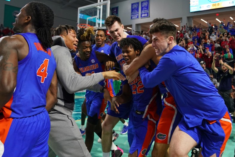 Nov 24, 2021; Fort Myers, Florida, USA; Florida Gators guard Tyree Appleby (22) celebrates with teammates after making the game winning three point shot to defeat the Ohio State Buckeyes at Suncoast Credit Union Arena. Mandatory Credit: Jasen Vinlove-USA TODAY Sports