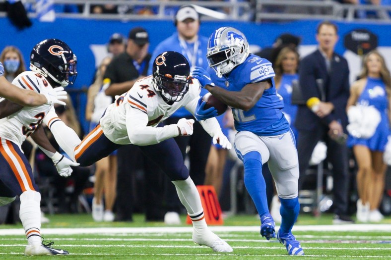 Nov 25, 2021; Detroit, Michigan, USA; Detroit Lions running back D'Andre Swift (32) gets chased by Chicago Bears inside linebacker Alec Ogletree (44) during the first quarter at Ford Field. Mandatory Credit: Raj Mehta-USA TODAY Sports