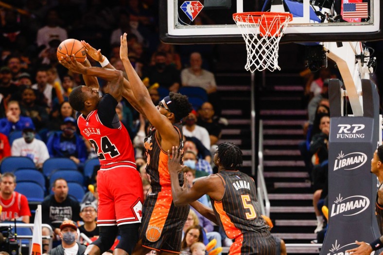 Nov 26, 2021; Orlando, Florida, USA;  Chicago Bulls forward Javonte Green (24) shoots the ball over Orlando Magic center Wendell Carter Jr. (34) in the first quarter at Amway Center. Mandatory Credit: Nathan Ray Seebeck-USA TODAY Sports