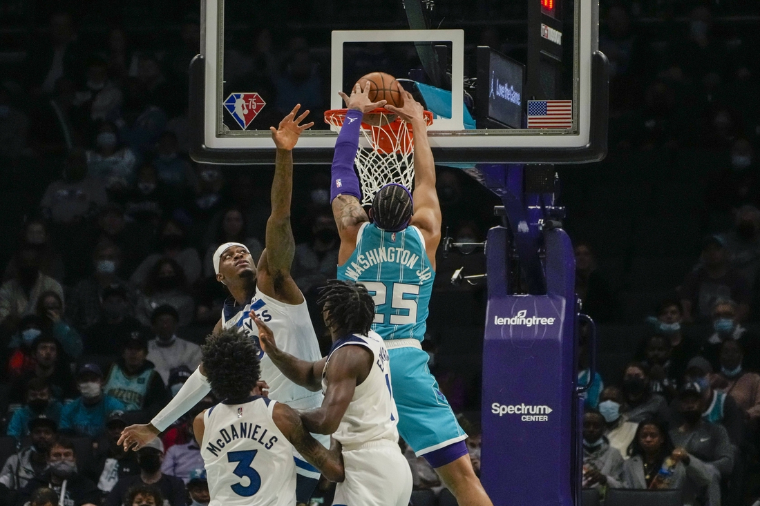 Nov 26, 2021; Charlotte, North Carolina, USA; Charlotte Hornets forward P.J. Washington (25) dunks the ball against the Minnesota Timberwolves during the first quarter at the Spectrum Center. Mandatory Credit: Jim Dedmon-USA TODAY Sports