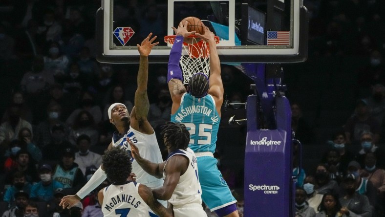 Nov 26, 2021; Charlotte, North Carolina, USA; Charlotte Hornets forward P.J. Washington (25) dunks the ball against the Minnesota Timberwolves during the first quarter at the Spectrum Center. Mandatory Credit: Jim Dedmon-USA TODAY Sports