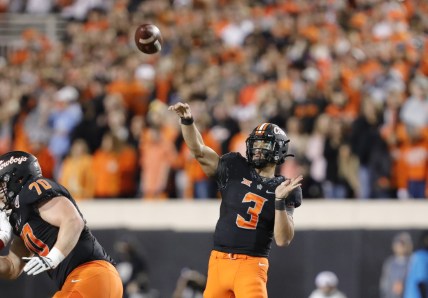 Nov 27, 2021; Stillwater, Oklahoma, USA; Oklahoma State Cowboys quarterback Spencer Sanders (3) passes the ball against the Oklahoma Sooners during the first half at Boone Pickens Stadium. Mandatory Credit: Alonzo Adams-USA TODAY Sports