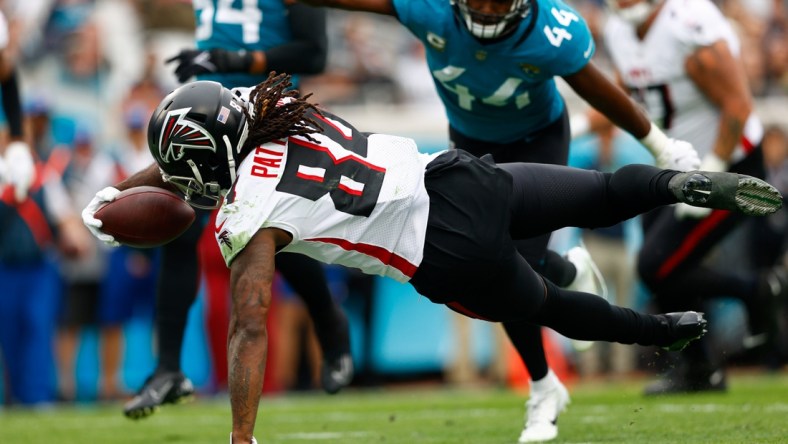 Nov 28, 2021; Jacksonville, Florida, USA;  Atlanta Falcons running back Cordarrelle Patterson (84) dives into the end zone for a touchdown in the first half against the Jacksonville Jaguars at TIAA Bank Field. Mandatory Credit: Nathan Ray Seebeck-USA TODAY Sports