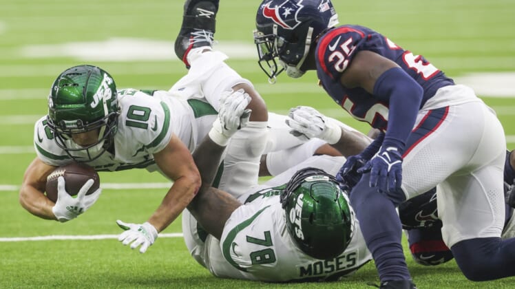 Nov 28, 2021; Houston, Texas, USA; New York Jets wide receiver Braxton Berrios (10) dives as he is tackled by the Houston Texans in the second quarter at NRG Stadium. Mandatory Credit: Thomas Shea-USA TODAY Sports