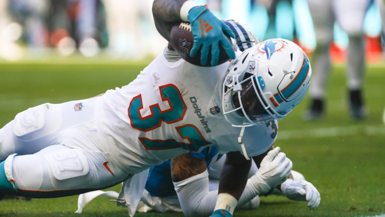 Nov 28, 2021; Miami Gardens, Florida, USA; Miami Dolphins running back Myles Gaskin (37) reaches the end zone for a touchdown against the Carolina Panthers during the second period at Hard Rock Stadium. Mandatory Credit: Sam Navarro-USA TODAY Sports