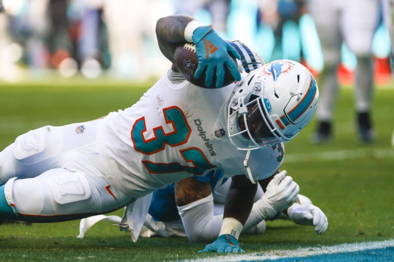 Nov 28, 2021; Miami Gardens, Florida, USA; Miami Dolphins running back Myles Gaskin (37) reaches the end zone for a touchdown against the Carolina Panthers during the second period at Hard Rock Stadium. Mandatory Credit: Sam Navarro-USA TODAY Sports