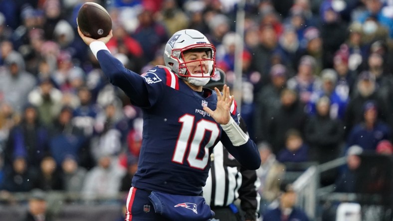 Nov 28, 2021; Foxborough, Massachusetts, USA; New England Patriots quarterback Mac Jones (10) throws a pass against the Tennessee Titans in the second quarter at Gillette Stadium. Mandatory Credit: David Butler II-USA TODAY Sports