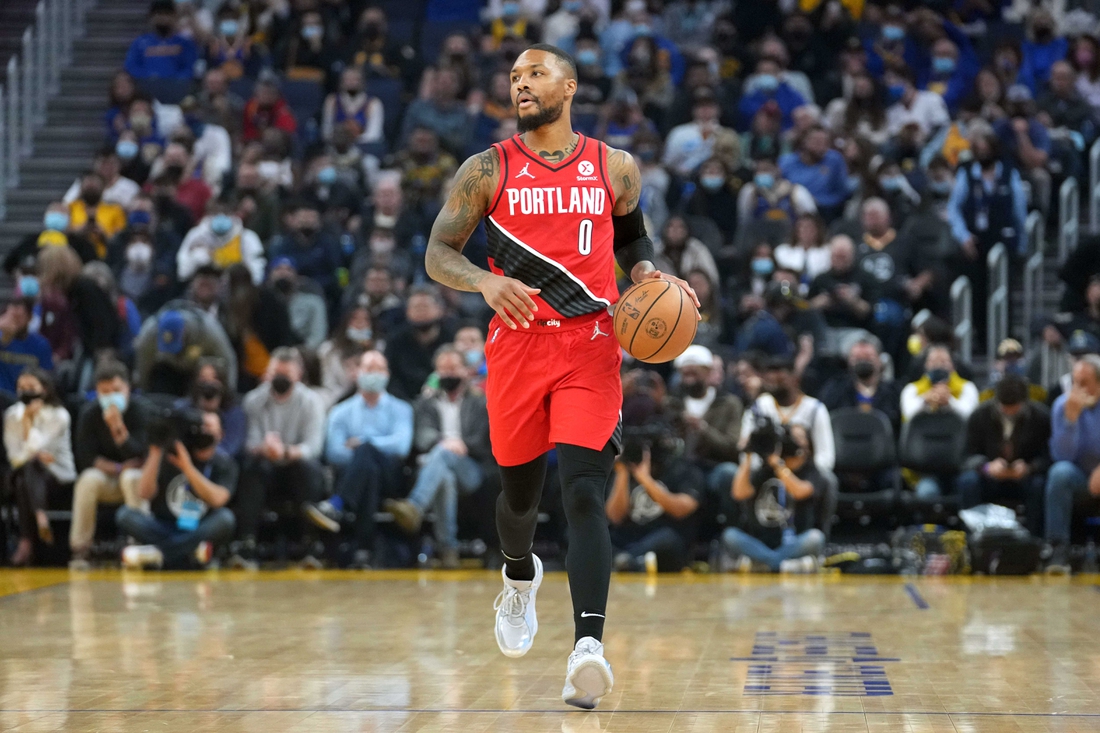 Nov 26, 2021; San Francisco, California, USA; Portland Trail Blazers guard Damian Lillard (0) dribbles during the first quarter against the Golden State Warriors at Chase Center. Mandatory Credit: Darren Yamashita-USA TODAY Sports