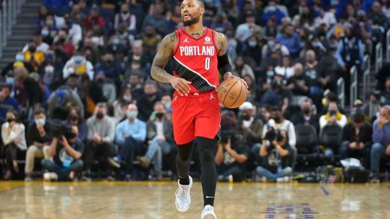 Nov 26, 2021; San Francisco, California, USA; Portland Trail Blazers guard Damian Lillard (0) dribbles during the first quarter against the Golden State Warriors at Chase Center. Mandatory Credit: Darren Yamashita-USA TODAY Sports