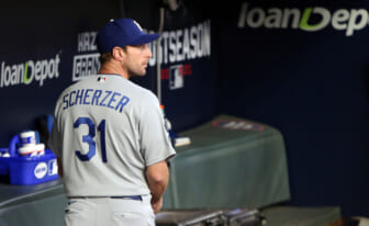 Oct 17, 2021; Cumberland, Georgia, USA; Los Angeles Dodgers manager Dave Roberts (30) walks back to the dugout after pulling starting pitcher Max Scherzer (31) cycles during the fifth inning against the Atlanta Braves in game two of the 2021 NLCS at Truist Park. Mandatory Credit: Brett Davis-USA TODAY Sports