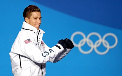 Feb 14, 2018; Pyeongchang, South Korea; Shaun White of the United States celebrates winning gold during the medals ceremony for the Men's Snowboard Halfpipe in the Pyeongchang 2018 Olympic Winter Games at Medals Plaza. Mandatory Credit: Soobum Im-USA TODAY Sports