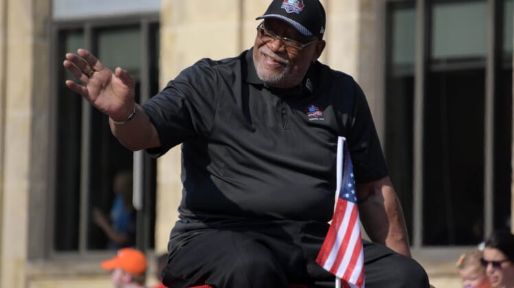 Aug 4, 2018; Canton, OH, USA; Atlanta Falcons and Philadelphia Eagles former defensive end Claude Humphrey acknowledges the crowd during the Pro Football Hall of Fame Grand Parade on Cleveland Avenue. Mandatory Credit: Kirby Lee-USA TODAY Sports