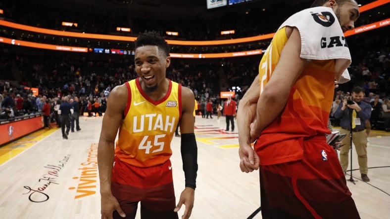 Jan 14, 2019; Salt Lake City, UT, USA; Utah Jazz guard Donovan Mitchell (45) reacts after distracting teammate Rudy Gobert (27) during  a postgame interview after their win against the Detroit Pistons at Vivint Smart Home Arena. Mandatory Credit: Jeff Swinger-USA TODAY Sports