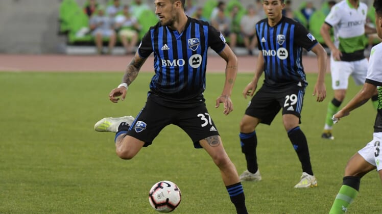 Jul 10, 2019; Toronto, Ontario, CAN;   Montreal Impact forward Maxi Urruti (37) controls a pass to midfielder Mathieu Choiniere (29) against York 9 in the second half of a Canadian Championship soccer match at York Lions Stadium. Mandatory Credit: Dan Hamilton-USA TODAY Sports for CPL