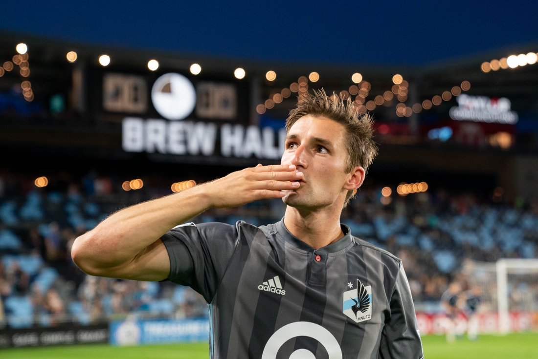 Jul 27, 2019; Saint Paul, MN, USA; Minnesota United forward Ethan Finlay (13) salutes the fans after the game against Vancouver Whitecaps at Allianz Field. Mandatory Credit: Brad Rempel-USA TODAY Sports