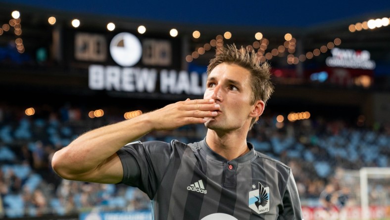 Jul 27, 2019; Saint Paul, MN, USA; Minnesota United forward Ethan Finlay (13) salutes the fans after the game against Vancouver Whitecaps at Allianz Field. Mandatory Credit: Brad Rempel-USA TODAY Sports