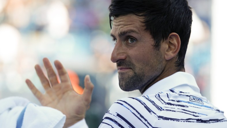 Novak Djokovic waves down the line between games in the first set during the Western & Southern Open match between Novak Djokovic and Sam Querrey at the Lindner Family Tennis Center in Mason, Ohio, on Tuesday, Aug. 13, 2019. Djokovic advanced in straight sets, 7-5, 6-1.

Novak Djokovic Vs Sam Querrey Western Southern Open