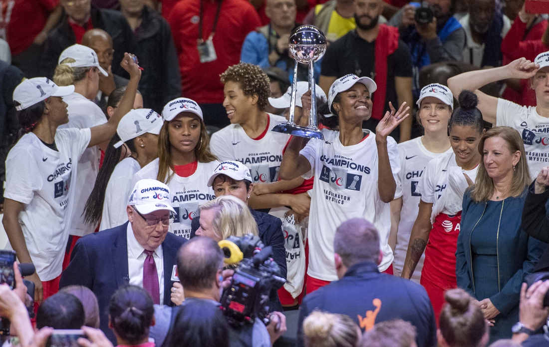 Oct 10, 2019; Washington, DC, USA; Washington Mystics players celebrate with the championship trophy after defeating Connecticut Sun in game five of the 2019 WNBA Finals at Entertainment and Sports Ar. Mandatory Credit: Brad Mills-USA TODAY Sports