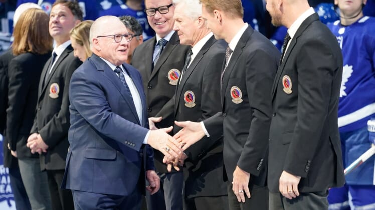 Nov 15, 2019; Toronto, Ontario, CAN; Class of 2019 Hockey Hall of Fame inductee Jim Rutherford  shakes hands with Nicklas Lindstrom prior to a game between the Boston Bruins and Toronto Maple Leafs at Scotiabank Arena. Mandatory Credit: John E. Sokolowski-USA TODAY Sports