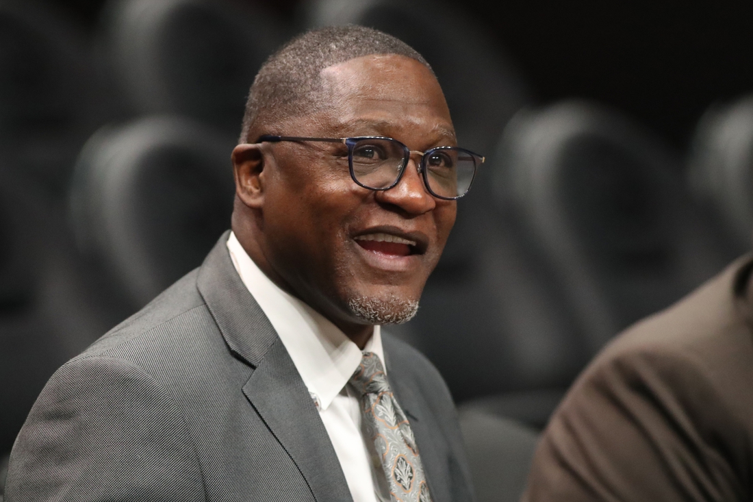 Mar 9, 2020; Atlanta, Georgia, USA; NBA Hall of Fame player Dominique Wilkins talks with Atlanta Hawks staff before the Hawks' game against the Charlotte Hornets at State Farm Arena. Mandatory Credit: Jason Getz-USA TODAY Sports