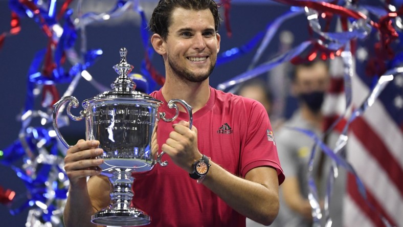 Sep 13 2020; Flushing Meadows, New York, USA; Dominic Thiem of Austria celebrates with the championship trophy after his match against Alexander Zverev of Germany (not pictured) in the men's singles final match on day fourteen of the 2020 U.S. Open tennis tournament at USTA Billie Jean King National Tennis Center. Mandatory Credit: Danielle Parhizkaran-USA TODAY Sports