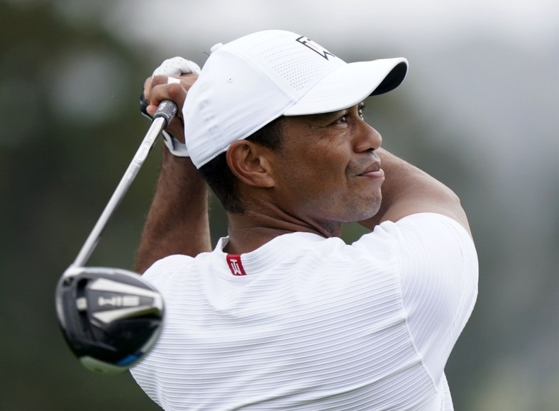 Nov 11, 2020; Augusta, Georgia, USA; Tiger Woods plays his tee shot on the first hole during a practice round for The Masters golf tournament at Augusta National GC. Mandatory Credit: Rob Schumacher-USA TODAY Sports